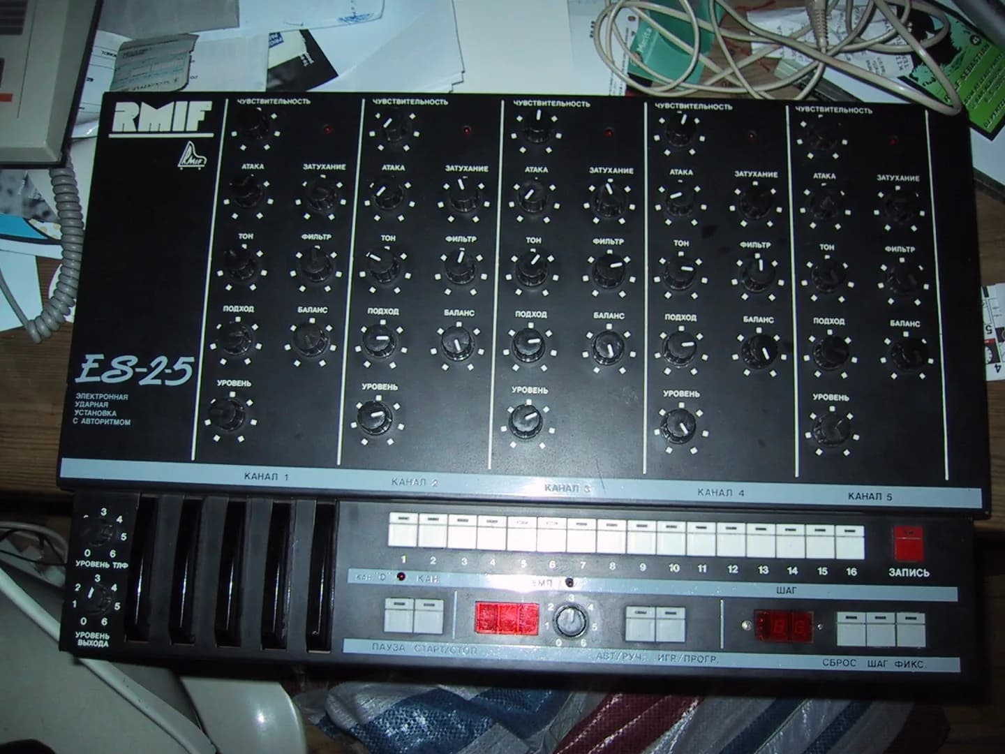 An RMIF ES-2-5 rhythm machine: five identical channel strips labelled in Russian above a sixteen-step button row.
